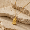 Gold PVD textured eye pendant necklace with coloured stone details on a fine chain.