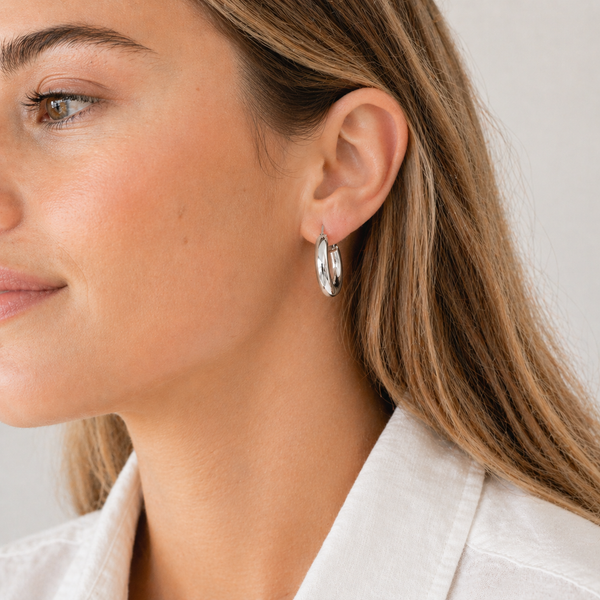 Chunky contour hoop earrings in gold and silver with a smooth polished finish