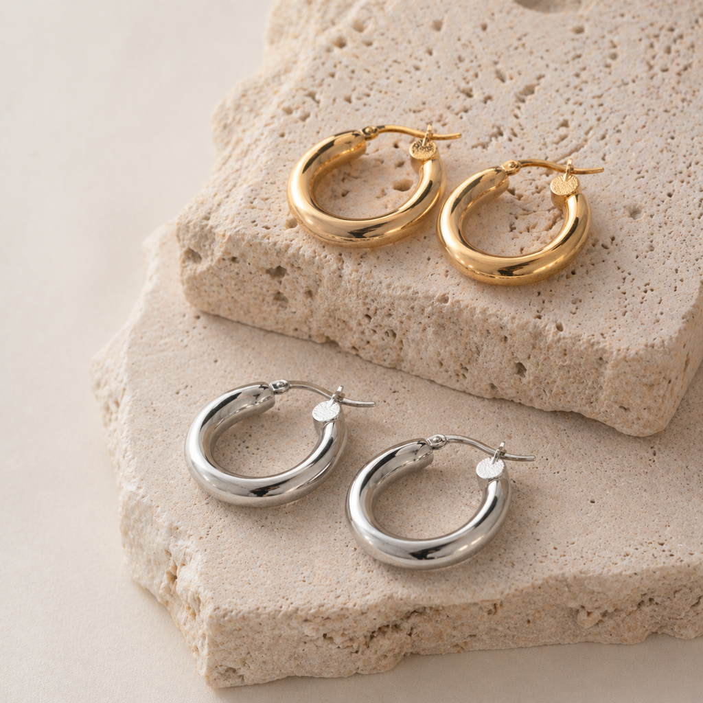 Chunky contour hoop earrings in gold and silver with a smooth polished finish