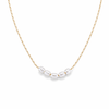 Lagoon pearl necklace with five organic pearls spaced along a fine stainless steel chain, available in gold and silver, worn at collarbone length.