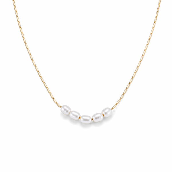Lagoon pearl necklace with five organic pearls spaced along a fine stainless steel chain, available in gold and silver, worn at collarbone length.