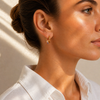 Gold huggie earrings with multi-colour stacked gemstone drop, 17mm hoop and 22mm total length.