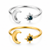 Gold and silver celestial moon and star adjustable ring with deep blue gemstone on white background.