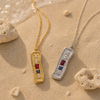 Textured bar pendant necklace with mixed stones in gold and silver finishes on a fine chain, modern coastal-inspired jewellery.