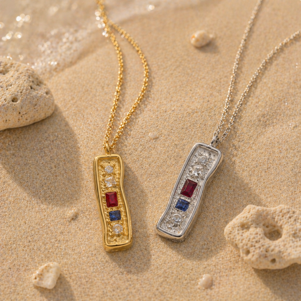 Textured bar pendant necklace with mixed stones in gold and silver finishes on a fine chain, modern coastal-inspired jewellery.