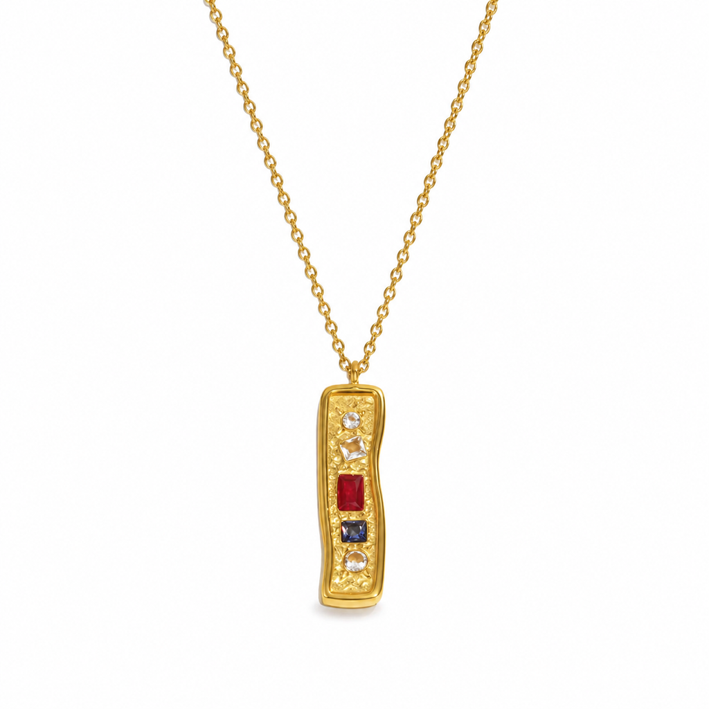 Textured bar pendant necklace with mixed stones in gold and silver finishes on a fine chain, modern coastal-inspired jewellery.