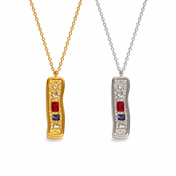 Textured bar pendant necklace with mixed stones in gold and silver finishes on a fine chain, modern coastal-inspired jewellery.
