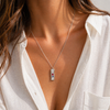 Textured bar pendant necklace with mixed stones in gold and silver finishes on a fine chain, modern coastal-inspired jewellery.