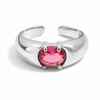 Gold and silver adjustable statement rings with oval pink crystal stones on a white background.