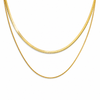 Gold layered necklace featuring a flat snake chain and fine chain creating a minimal stacked jewellery look