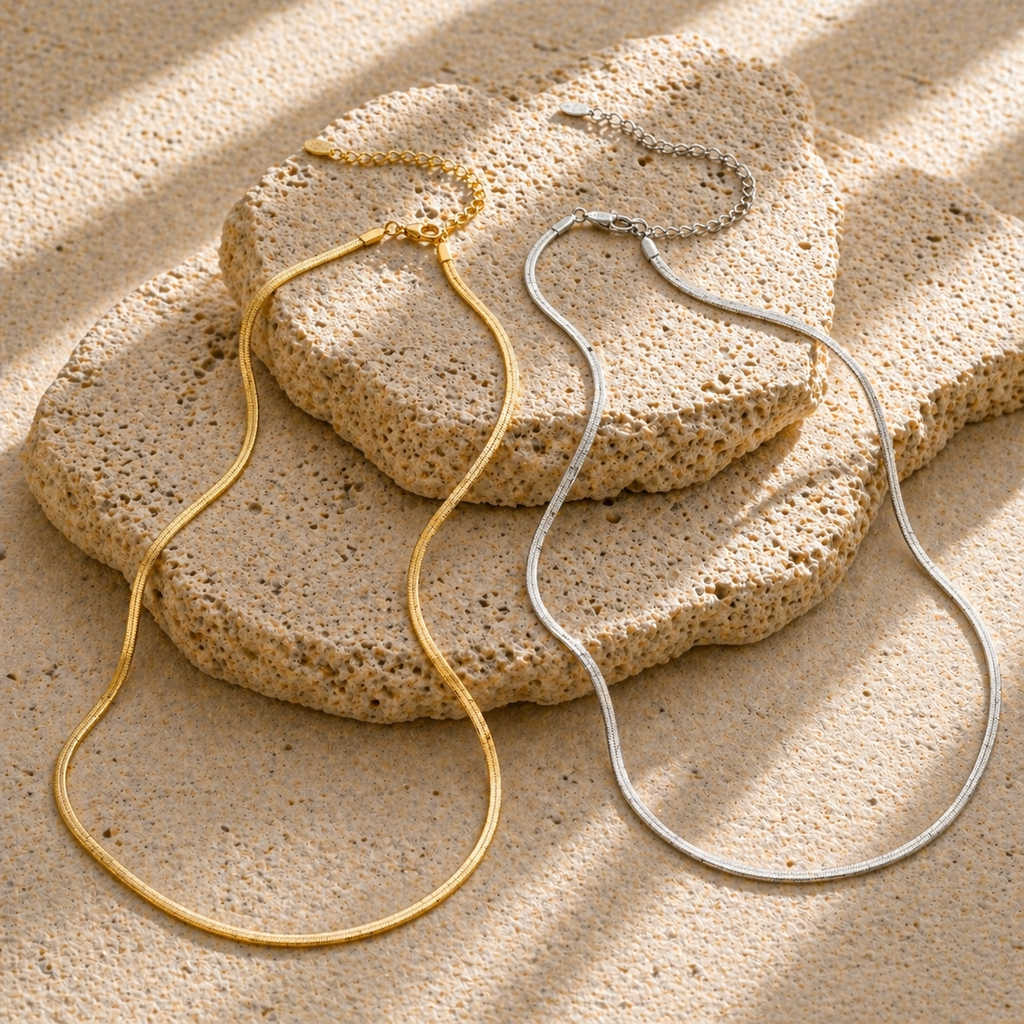 Gold flat 3mm chain necklace worn on neck with smooth reflective finish, minimal modern jewellery style