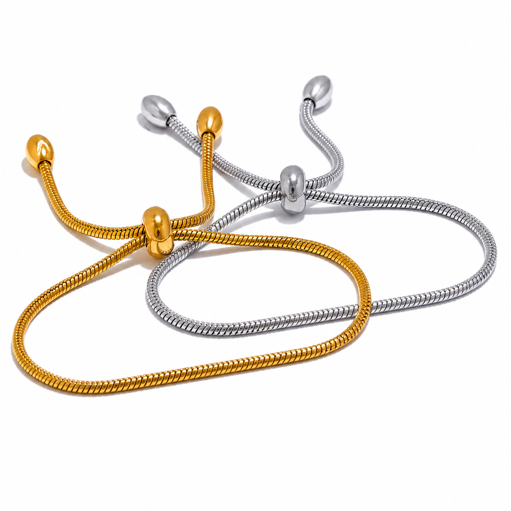 Adjustable snake chain bracelet with sliding clasp in gold and silver stainless steel on white background