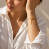 Adjustable snake chain bracelet with sliding clasp in gold and silver stainless steel on white background