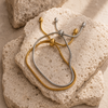 Adjustable snake chain bracelet with sliding clasp in gold and silver stainless steel on white background