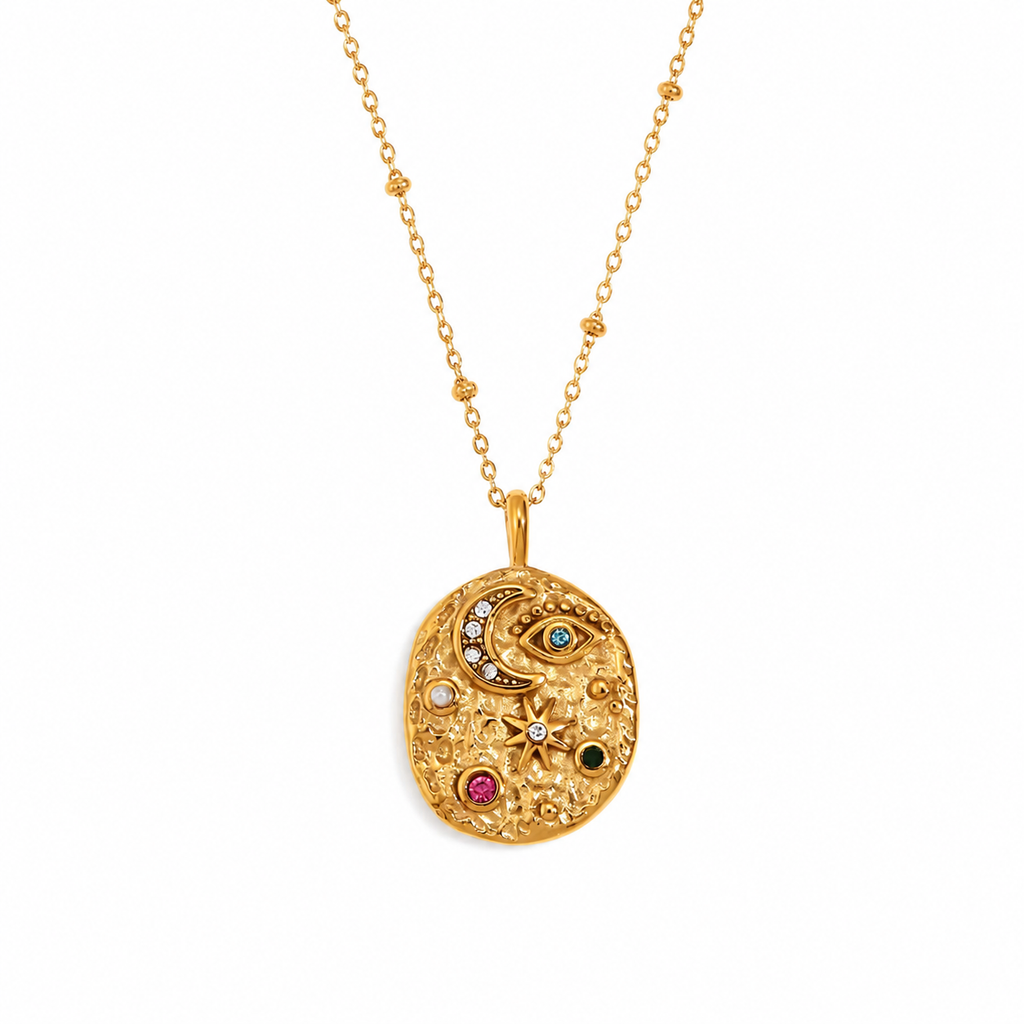 Gold celestial medallion pendant necklace featuring eye, moon and star detailing with coloured gemstones on a fine beaded chain.