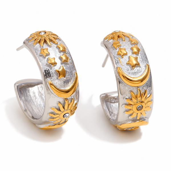 Gold and silver celestial hoop earrings with sun, moon and star detailing on a textured wide band, waterproof and ocean-proof, 20mm diameter.