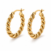 Twisted rope hoop earrings in gold and silver, 2.4cm diameter with a thick textured design and latch closure.