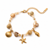 Gold PVD beaded charm bracelet with shell and starfish pendants on a fine chain