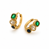Gold huggie earrings with three stacked stones in green, clear and navy, textured bezel settings, minimal white background