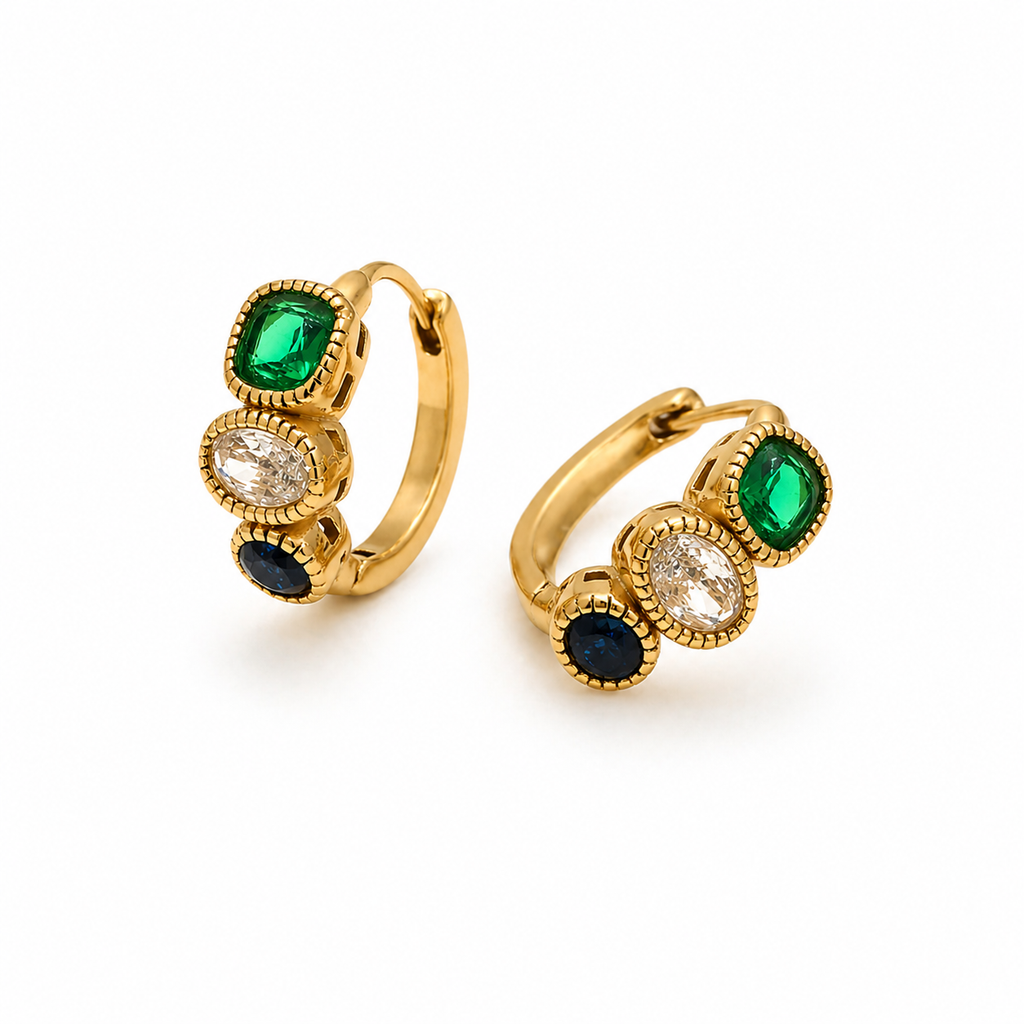 Gold huggie earrings with three stacked stones in green, clear and navy, textured bezel settings, minimal white background